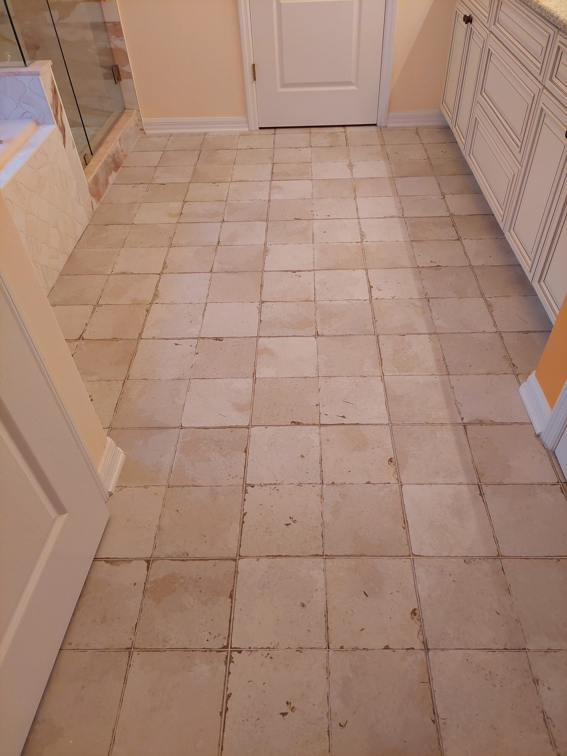 Close-up of installed tile showing the texture and grout lines in a room.