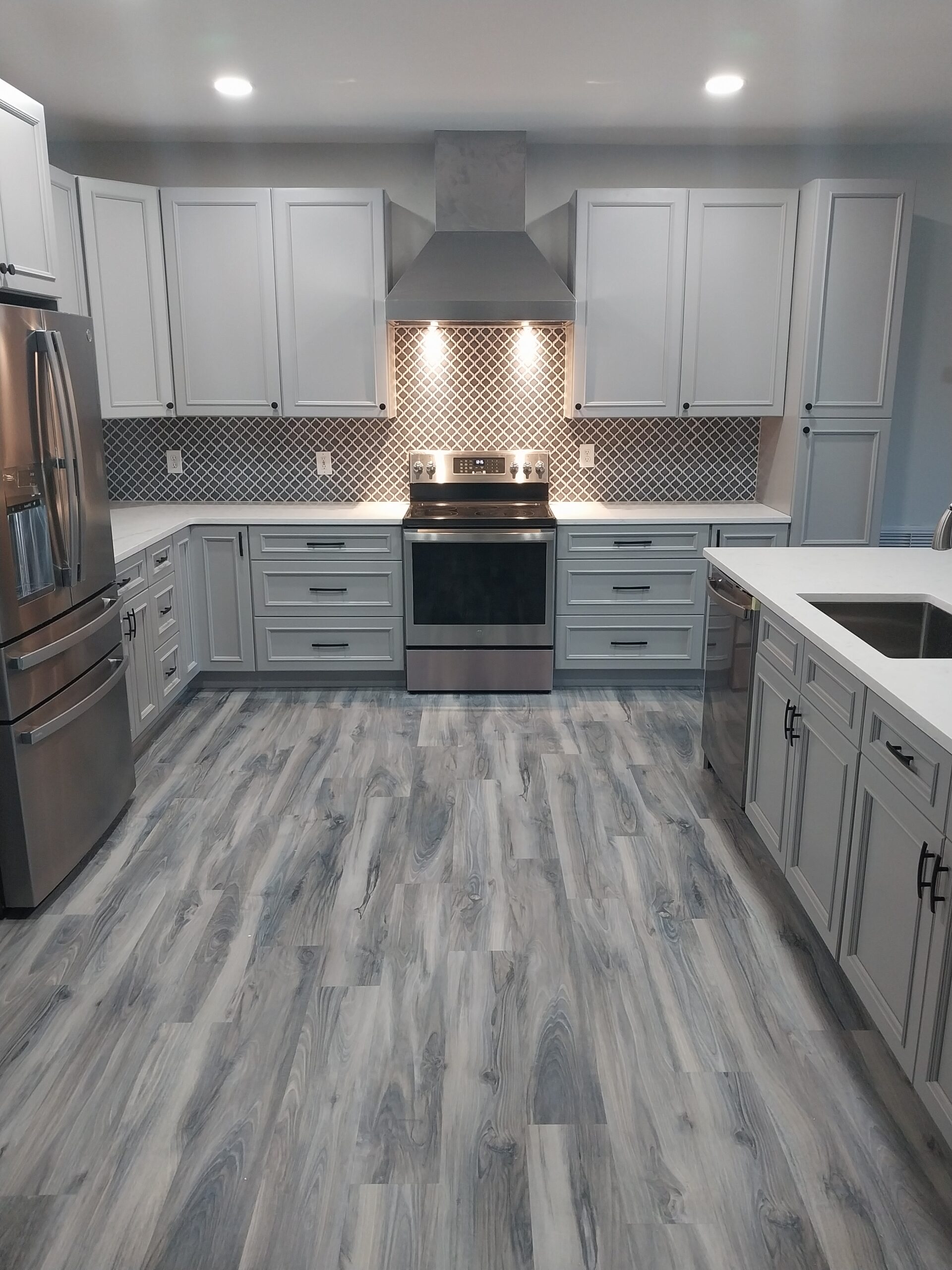 "Professional kitchen LVT and cabinet installation by Paul’s Masterpiece Tile in Rockledge, FL"