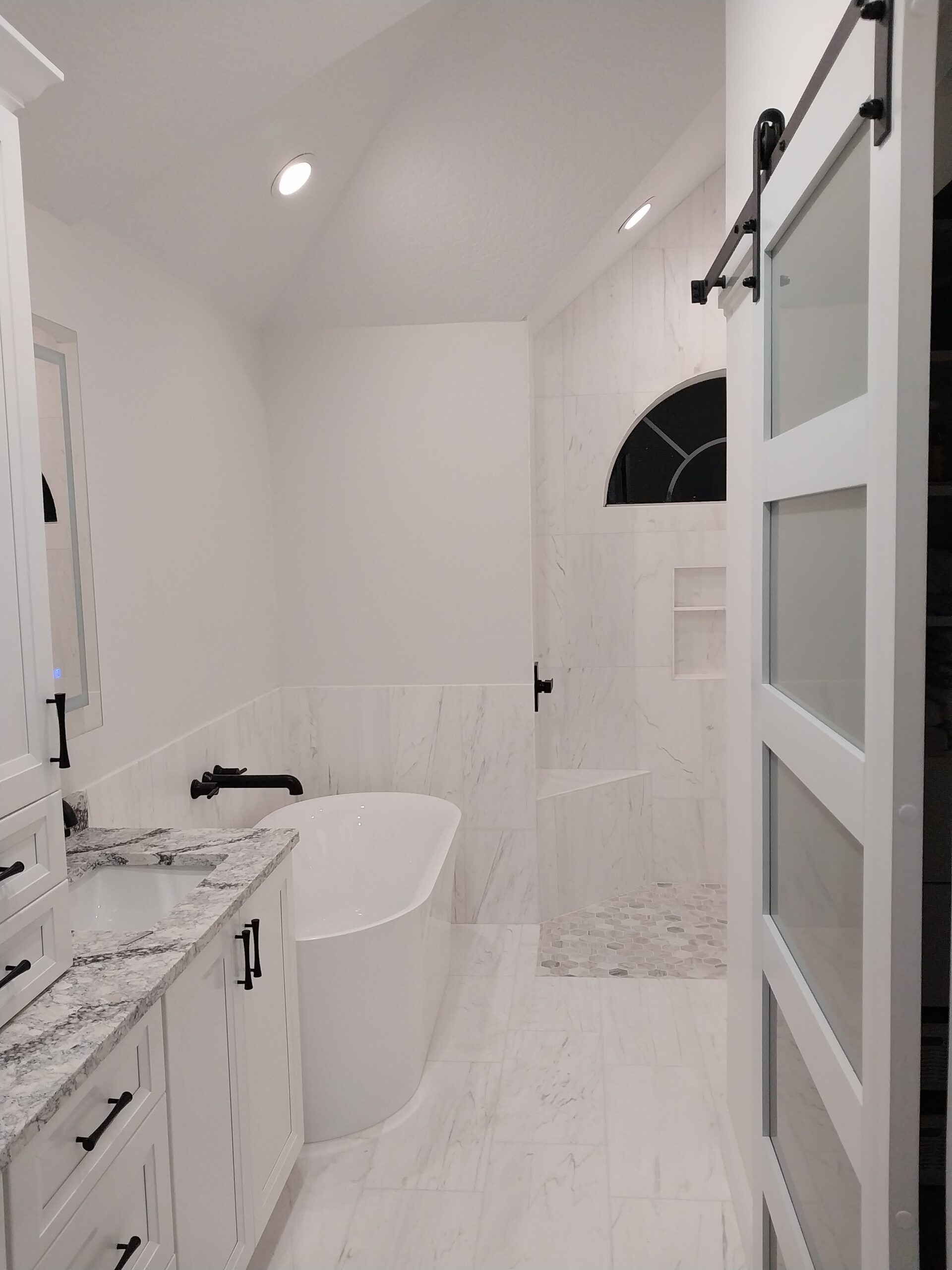 "Bathroom tile installation by Paul’s Masterpiece Tile."